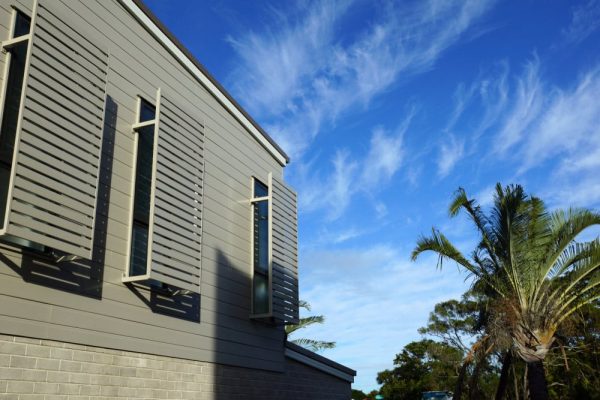 Fixed aluminium shutters on the exterior of a building on the Sunshine Coast