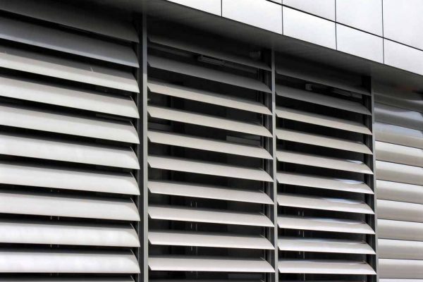 Grey Aluminium Shutters In The Exterior Of A Building